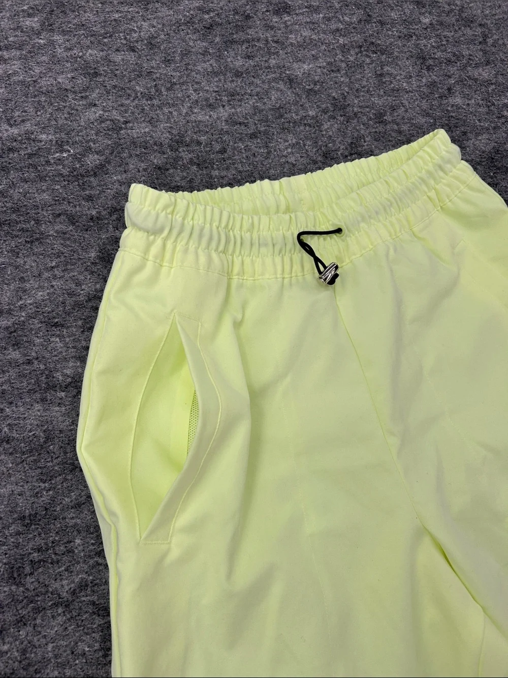 Nike Women's Sportswear Woven Pants in a bright neon green/yellow XS